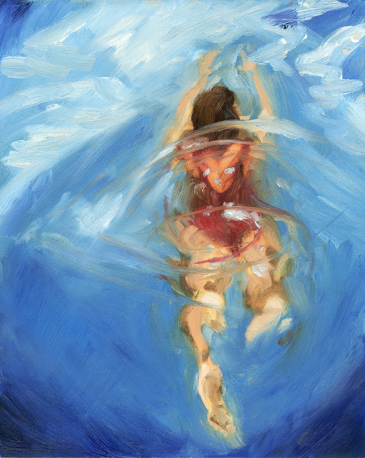Overhead view of a swimmer in a red suit gliding through brilliant turquoise pool water, light patterns rippling across the bottom.